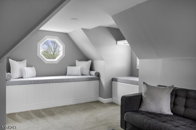 bedroom featuring carpet floors, baseboards, and vaulted ceiling