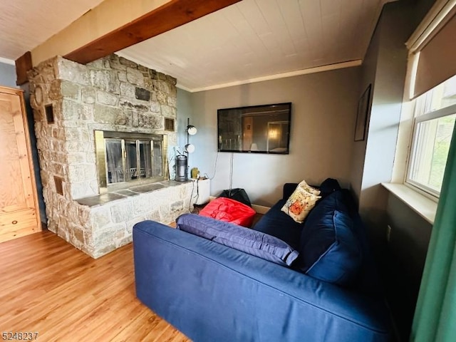 639 Canistear Rd, Vernon Twp, NJ 07422 - living area with beamed ceiling, ornamental molding, a fireplace, and wood finished floors