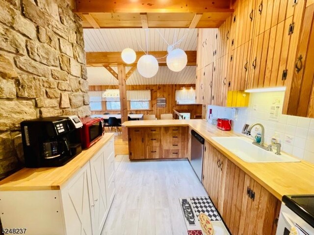 639 Canistear Rd, Vernon Twp, NJ 07422 - kitchen with wooden counters, stainless steel dishwasher, a sink, light wood finished floors, and a peninsula