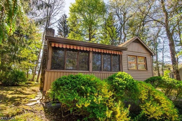 exterior space featuring a sunroom