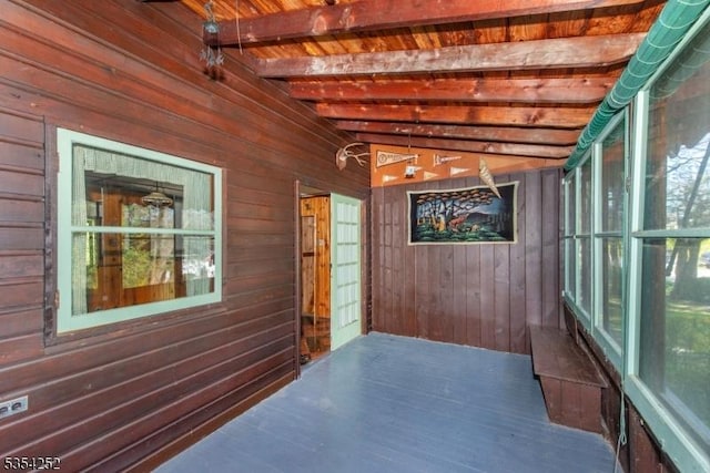 interior space featuring beamed ceiling and a wealth of natural light