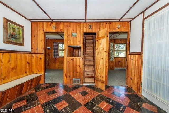interior space with wooden walls and visible vents