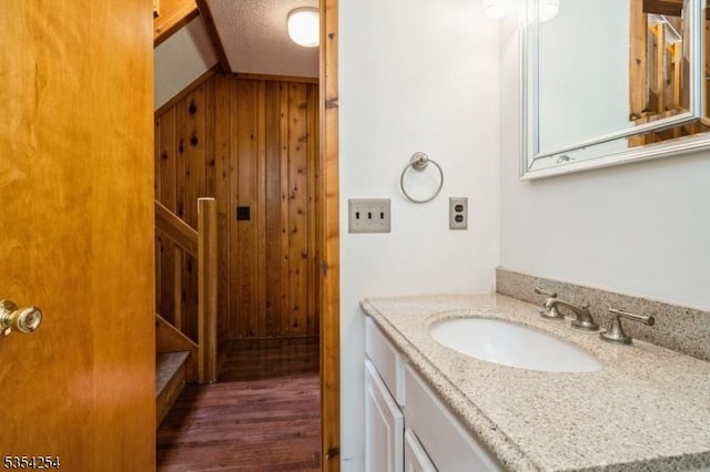 bathroom with vanity and wood finished floors