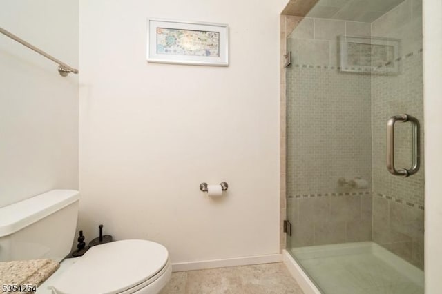 full bath with tile patterned floors, toilet, and a shower stall