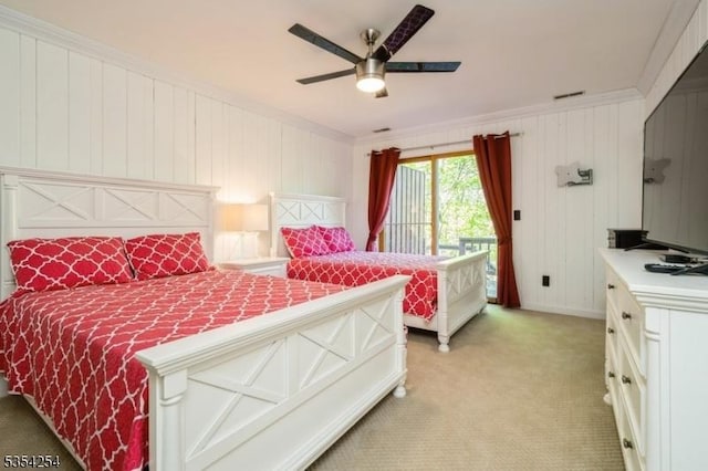 bedroom with ornamental molding, light carpet, ceiling fan, and access to exterior