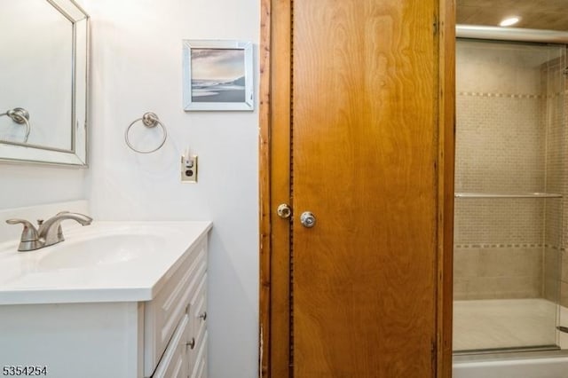 bathroom with vanity and a shower stall