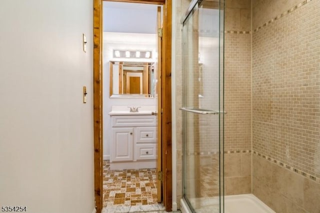 bathroom with vanity and a stall shower