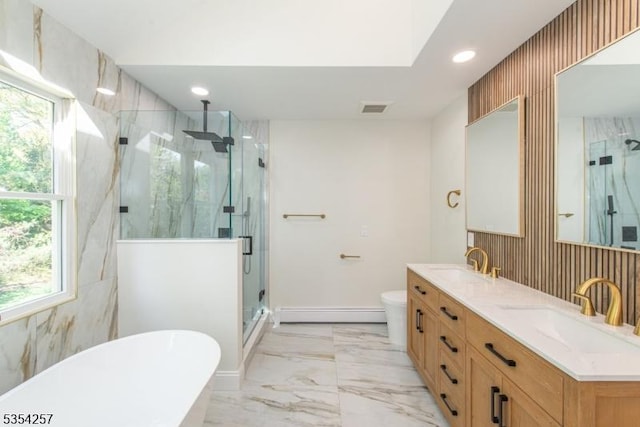 full bath featuring marble finish floor, a sink, a wealth of natural light, and visible vents