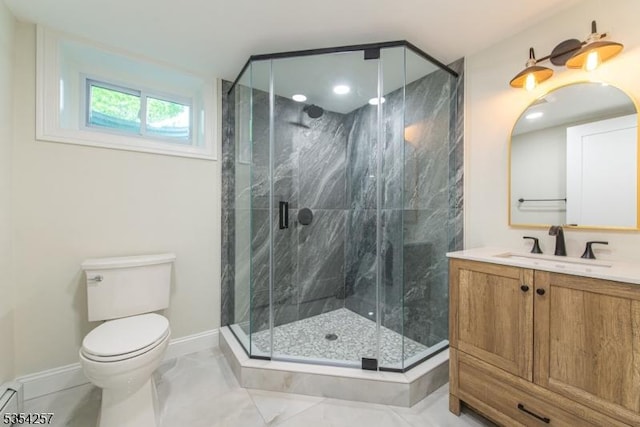 bathroom with toilet, baseboards, a marble finish shower, and vanity