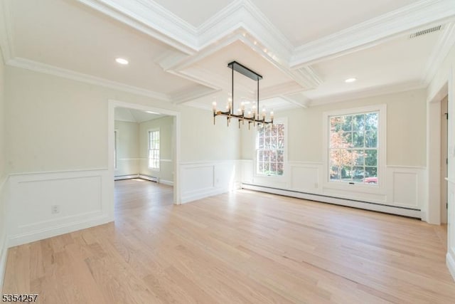 unfurnished dining area with an inviting chandelier, ornamental molding, a decorative wall, light wood-type flooring, and a baseboard radiator