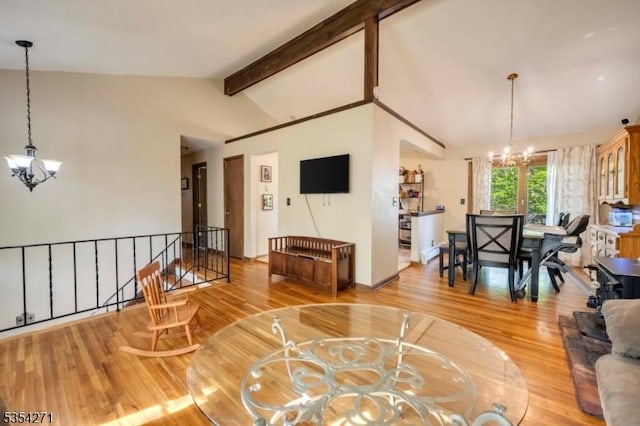 12 Fox Ledge Dr, Vernon Twp, NJ 07418 - living room featuring an inviting chandelier, lofted ceiling with beams, and wood finished floors