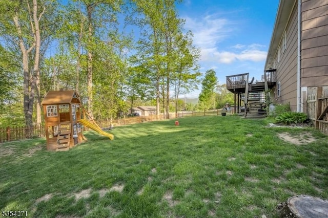 12 Fox Ledge Dr, Vernon Twp, NJ 07418 - view of yard with fence private yard, a wooden deck, stairs, and a playground