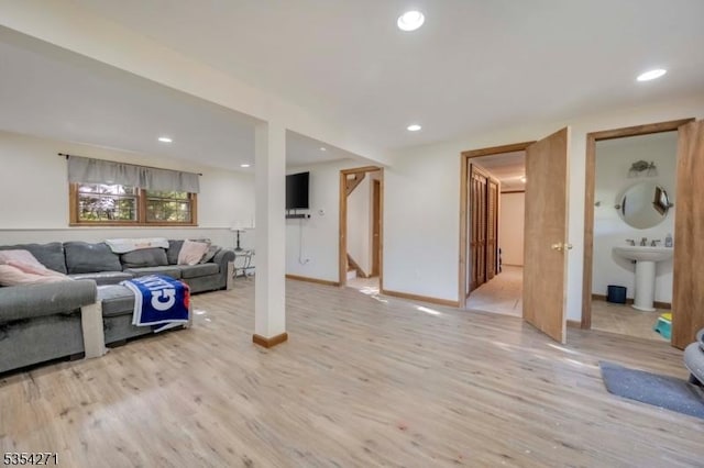 12 Fox Ledge Dr, Vernon Twp, NJ 07418 - living area featuring baseboards, recessed lighting, light wood-style flooring, and stairs