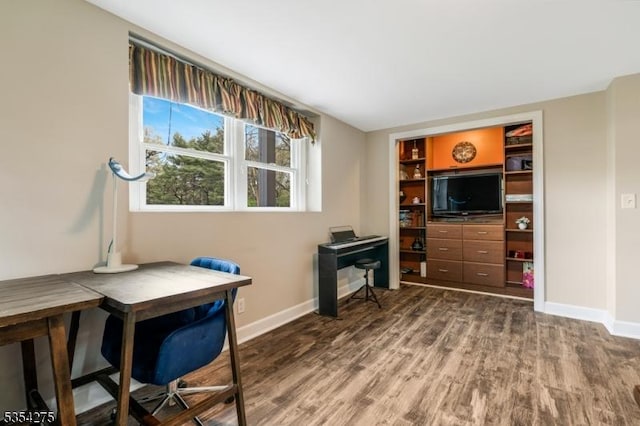 office featuring baseboards and wood finished floors