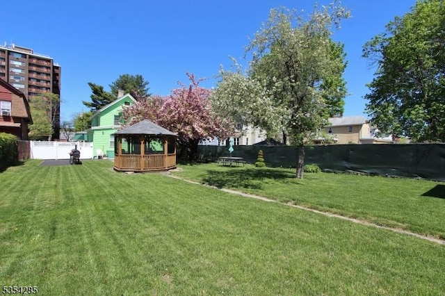 view of yard featuring a fenced backyard and a gazebo