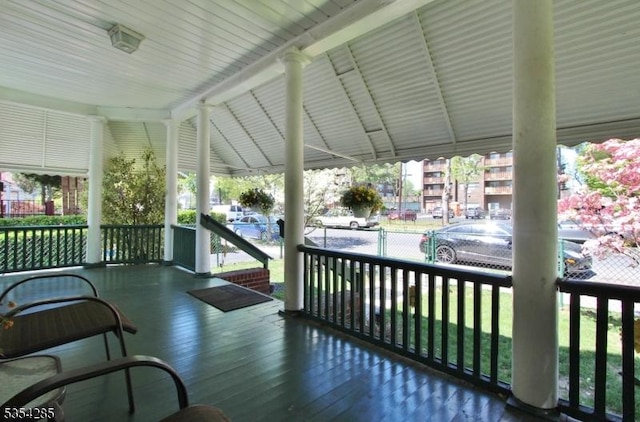 wooden terrace featuring a porch