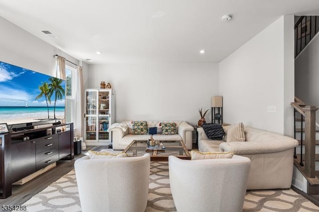 living room featuring light wood-type flooring and recessed lighting