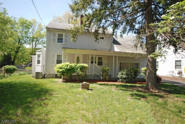 29 Olcott St, Franklin Twp, NJ 08873 - back of house with a lawn and central AC unit