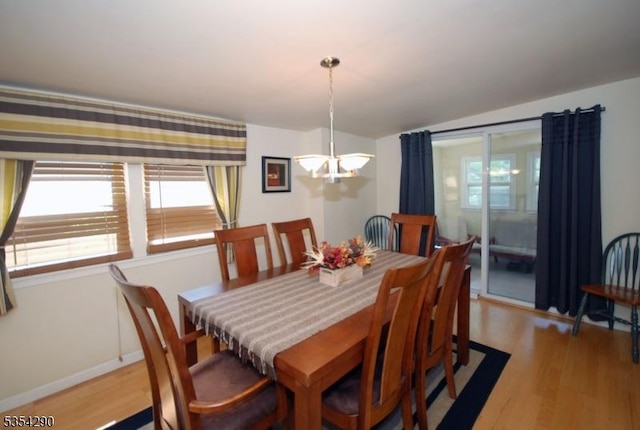 29 Olcott St, Franklin Twp, NJ 08873 - dining space with an inviting chandelier, light wood finished floors, baseboards, and a wealth of natural light