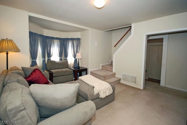 29 Olcott St, Franklin Twp, NJ 08873 - carpeted living room with visible vents, baseboards, and stairway