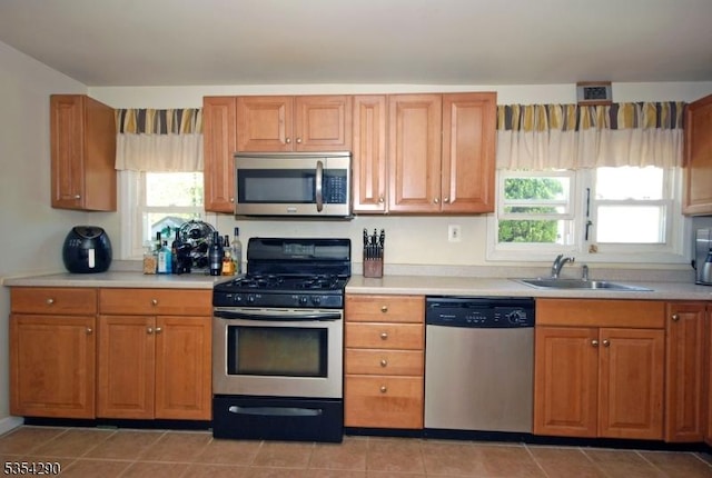 29 Olcott St, Franklin Twp, NJ 08873 - kitchen with visible vents, light countertops, brown cabinets, a sink, and appliances with stainless steel finishes
