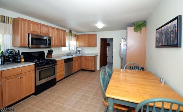 29 Olcott St, Franklin Twp, NJ 08873 - kitchen featuring light countertops, stainless steel appliances, and a sink