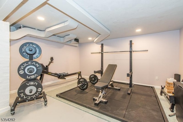 exercise room with baseboards and recessed lighting