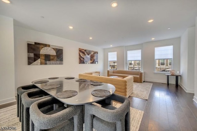 dining area with baseboards, recessed lighting, and wood finished floors