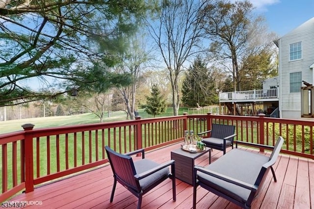deck featuring a lawn