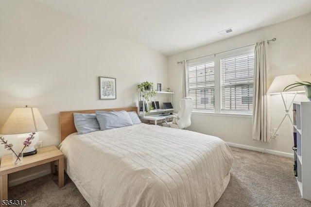 carpeted bedroom with visible vents, baseboards, and lofted ceiling