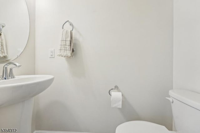 bathroom featuring a sink and toilet