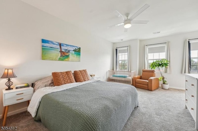 bedroom featuring baseboards, ceiling fan, carpet, and visible vents
