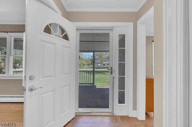 entryway featuring baseboards, ornamental molding, a baseboard heating unit, and light tile patterned flooring