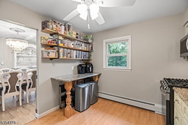 home office with a baseboard heating unit, light wood finished floors, and ceiling fan with notable chandelier
