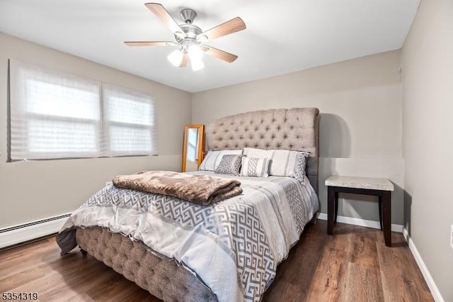 bedroom with a ceiling fan, baseboards, wood finished floors, and a baseboard radiator