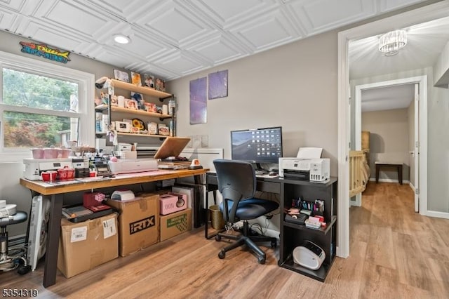 office with light wood-type flooring