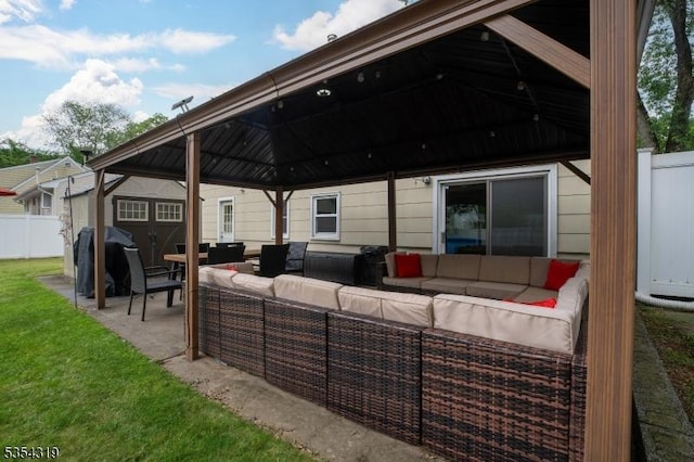 view of patio / terrace featuring fence, a gazebo, and outdoor lounge area