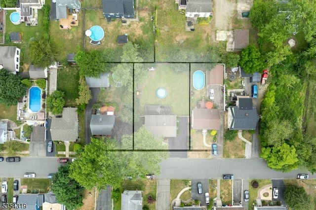 birds eye view of property with a residential view