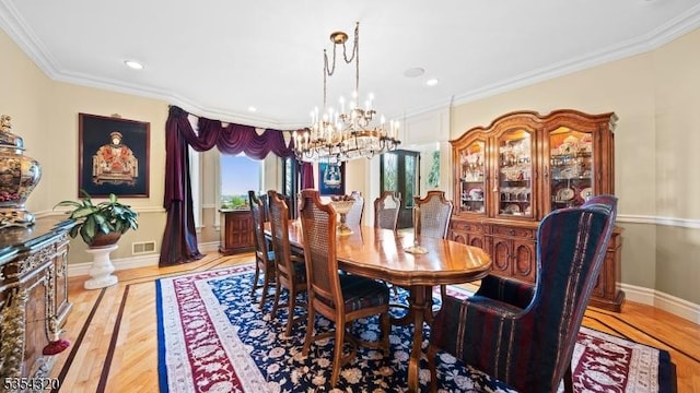 37 Gregory Ave, West Orange Twp, NJ 07052 - dining space with a chandelier, crown molding, light wood finished floors, recessed lighting, and baseboards