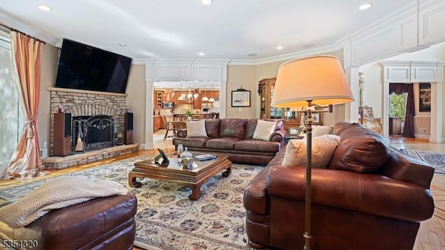 37 Gregory Ave, West Orange Twp, NJ 07052 - living room with recessed lighting, a stone fireplace, and ornamental molding
