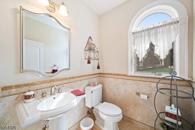 37 Gregory Ave, West Orange Twp, NJ 07052 - half bath with tile walls, toilet, a wainscoted wall, and tile patterned floors