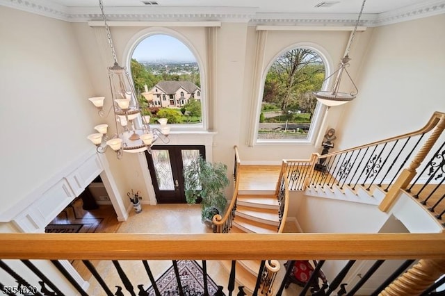 37 Gregory Ave, West Orange Twp, NJ 07052 - foyer with a towering ceiling, stairway, crown molding, baseboards, and a chandelier