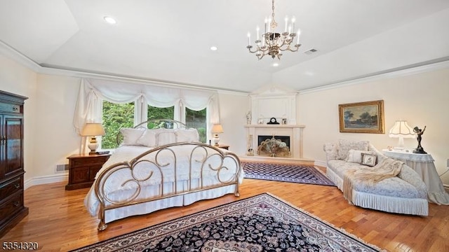 37 Gregory Ave, West Orange Twp, NJ 07052 - bedroom with wood finished floors, a chandelier, vaulted ceiling, baseboards, and a raised ceiling