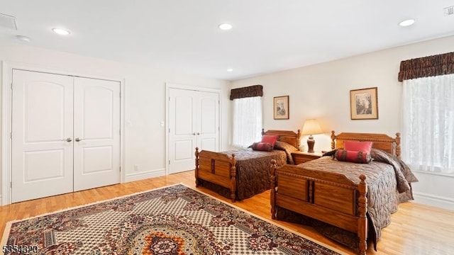 37 Gregory Ave, West Orange Twp, NJ 07052 - bedroom with multiple windows, wood finished floors, multiple closets, recessed lighting, and baseboards