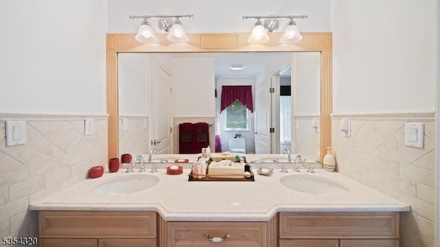 37 Gregory Ave, West Orange Twp, NJ 07052 - full bath featuring tile walls, wainscoting, and double vanity