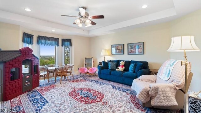 37 Gregory Ave, West Orange Twp, NJ 07052 - living room with ceiling fan, recessed lighting, a raised ceiling, and baseboards