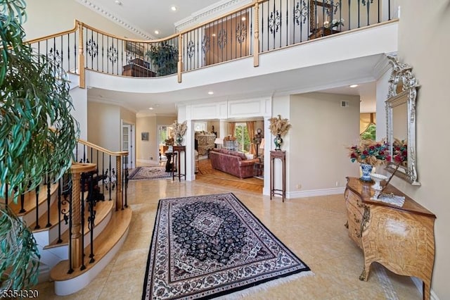 37 Gregory Ave, West Orange Twp, NJ 07052 - foyer entrance with crown molding, stairs, a towering ceiling, baseboards, and recessed lighting
