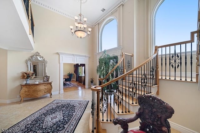 37 Gregory Ave, West Orange Twp, NJ 07052 - entryway with a chandelier, plenty of natural light, a towering ceiling, baseboards, and stairs