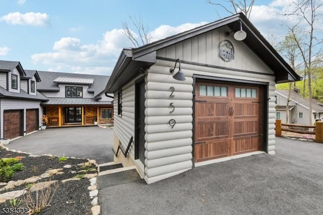 garage with aphalt driveway