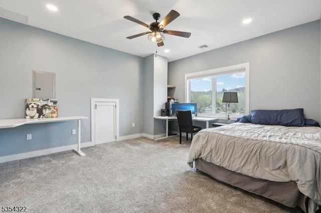 bedroom featuring visible vents, recessed lighting, carpet floors, and electric panel